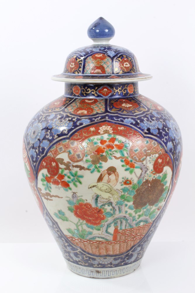 Late 19th century Japanese Imari baluster vase and cover with polychrome enamel bird and shi shi