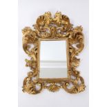 Ornate 19th century carved giltwood wall mirror the rectangular plate within pierced scrolling