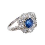Sapphire and diamond cluster ring, the central mixed cut blue sapphire measuring approximately 5.
