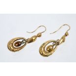 Pair of Victorian yellow metal pendant earrings with wirework decoration,