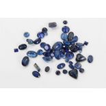 Unmounted mixed cut blue sapphires.