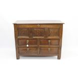 Early 18th century oak mule chest with hinged moulded lid over triple panel front and four short
