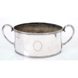 Large Victorian silver sugar bowl of oval form with reeded borders and twin scroll handles (London