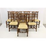 Set of eight 19th century beech spindle back country chairs, each with high back and rush seat,