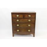 Regency mahogany and boxwood line inlaid chest of drawers with two short over three long drawers on