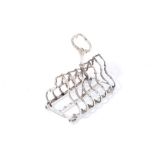 Victorian silver six division toast rack of Gothic shape with central carrying handle on four bun