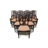 Long set of ten Sheraton-style mahogany dining chairs each with arched swag carved vertical bar