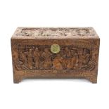 Good early 20th century Chinese carved camphor-wood chest carved in high relief to the hinged top