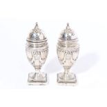 Late Victorian silver pepperette of urn form, with classical fluted and swag decoration,