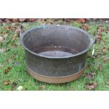 Large copper vessel straight sided with everted rim and loop handles,