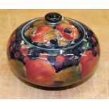 Moorcroft Pomegranate pattern ovoid jar and cover on blue ground - green signature and impressed