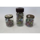 Collection of 19th century and later glass marbles in three jars CONDITION REPORT