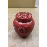 William Moorcroft Flamminian ware red glazed potpourri vase and screw-top pierced cover and foliate