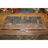 1930s printers' carved wood type / lettering in tray - including Gill Sans,
