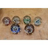 Six Caithness 'Myriad' 1978 glass paperweights,