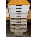 Nest of sixteen graduated drawers containing a large quantity of costume jewellery