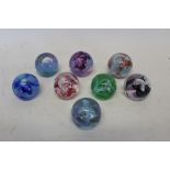 Eight Caithness 'Mooncrystal' glass paperweights