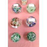 Six Langham glass paperweights made by Paul Miller