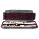 Contemporary Yamaha flute in a fitted case and cover, music stand,