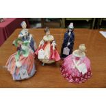 Five Royal Doulton figures - Autumn Breezes HN1911, Southern Belle HN2229, Victoria HN2471,