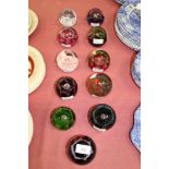 Eleven Caithness 'Maydance' 1972 - 1995 glass paperweights by Colin Terris