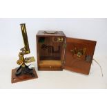 Early 20th century lacquered brass microscope, in mahogany case,