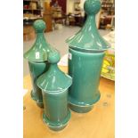 Three large decorative green glazed storage jars with lids