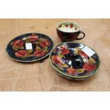 Moorcroft Pomegranate pattern tea cup and two saucers and similar tea plate - blue signatures,