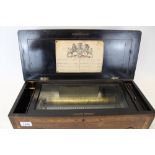 Victorian mechanical music box playing eight airs, in a rosewood veneered case,
