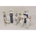 Seven Lladro porcelain figures - including two nuns, lady with goose, girl with cat,