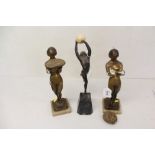 Pair of bronzed Art Deco-style figures of naked females holding up baskets of flowers