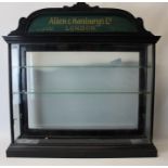 Early 20th century ebonised wood pharmaceutical shop display cabinet of rectangular form,