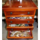 Four-drawer cabinet containing gilt metal jewellery, vintage brooches, beads,
