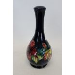 Moorcroft Pottery table lamp decorated in the Hibiscus pattern on blue ground,