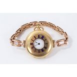 Gold (18ct) half hunter fob watch converted to a wristwatch on expandable rose gold (9ct) bracelet