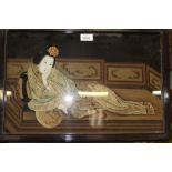 Chinese reverse painting on glass depicting a courtesan in an interior, in carved wood frame,