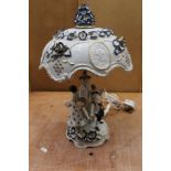 Good quality blue and white porcelain table lamp and shade decorated with four figures