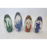 Four Strathearn 'Tropic' glass paperweights