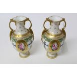 Pair of Royal Crown Derby two-handled vases with floral painted reserves, pattern no.