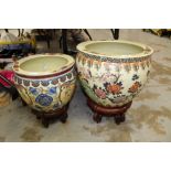 Two Oriental jardinières on stands CONDITION REPORT Smaller one is cracked,