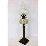 Victorian duplex brass oil lamp with marbled 'end of day glass' reservoir and clear glass shade,