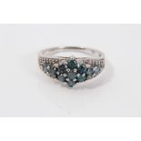 White gold (14ct) teal blue heat-treated diamond ring, size O,