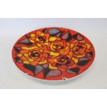 Large Poole Delphis charger with abstract decoration on red, yellow and orange ground, 41.