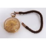 Gold (18ct) cased pocket watch with floral scroll gilt dial and Roman numeral markers,