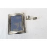 Contemporary silver photograph frame and two silver napkin rings (3)
