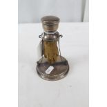 George V Taxidermy: Otter Paw, mounted in the frame of a silver inkwell with hinged cover,