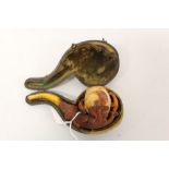 Victorian meerschaum pipe in the form of an eagle's claw, with amber mouthpiece,