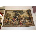 Two decorative embroidered wall tapestries depicting cherubs and romantic scenes