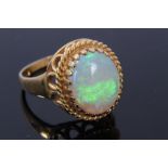 Gold opal single stone ring.