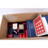 Accessories in two boxes – to include Whitman coin folders (x 46), plastic coin capsules,